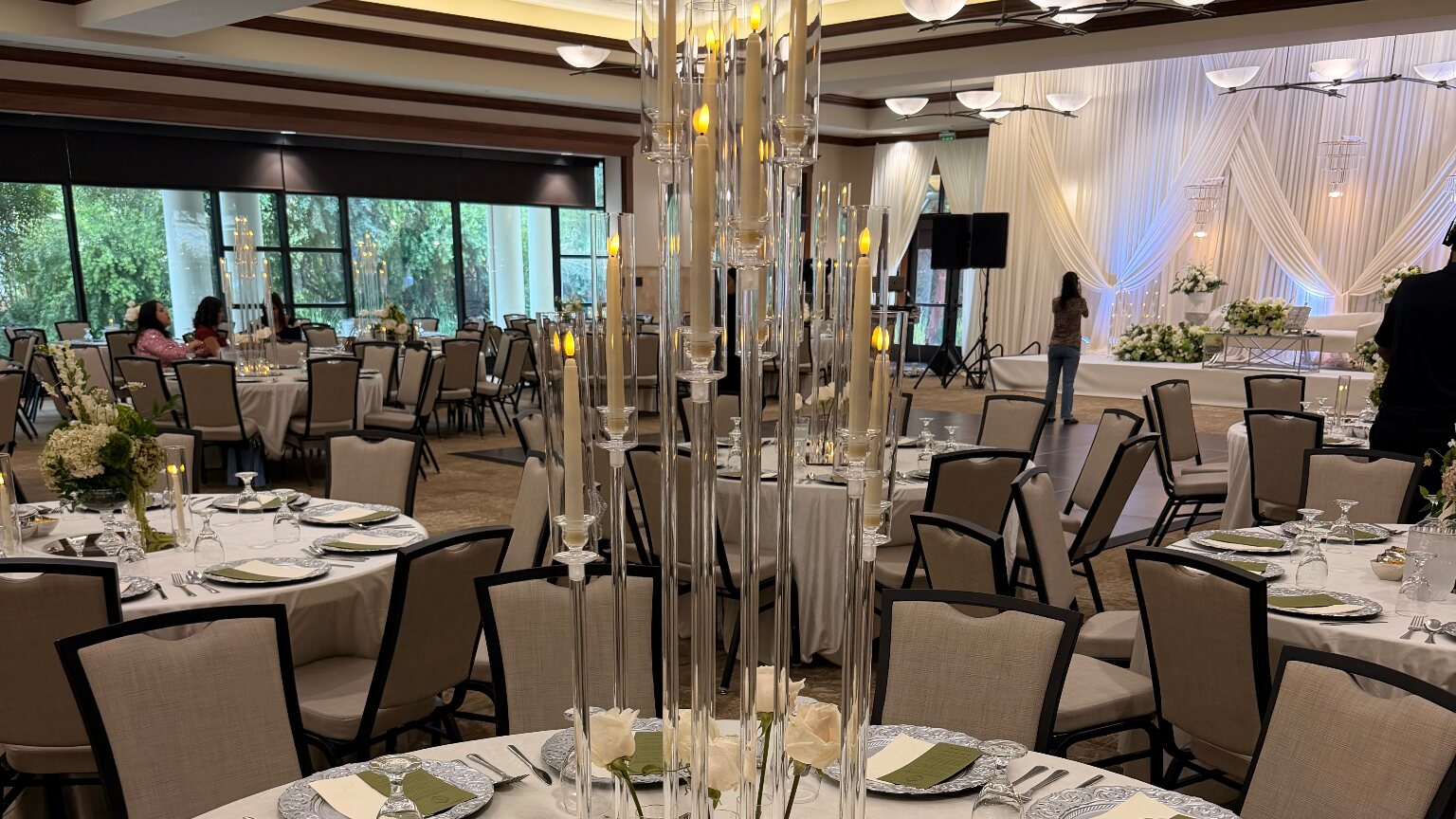 Ballroom set with place settings and candle centrepieces at an S_R_EventServices event